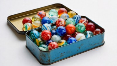 Colorful Marbles in Open Tin Box