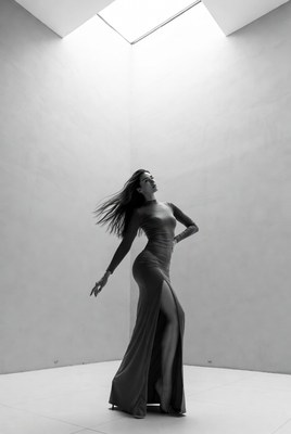 Woman dancing in long slit gown