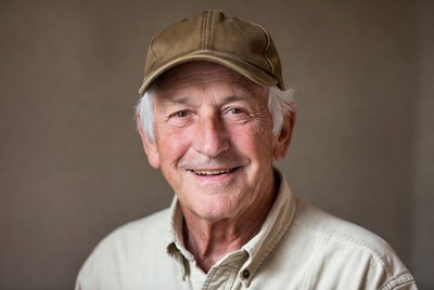 Smiling elderly man in cap