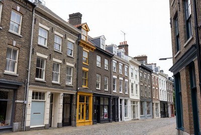 Colorful terraced houses on cobblestone street