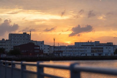 City skyline at sunset over water