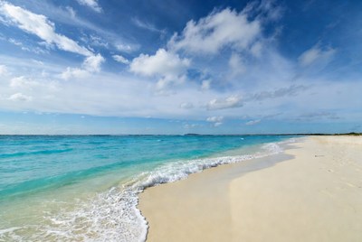 Turquoise Ocean Waves on White Sand Beach