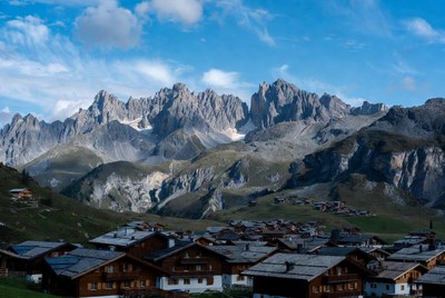 Alpine Village with Dolomites Mountains