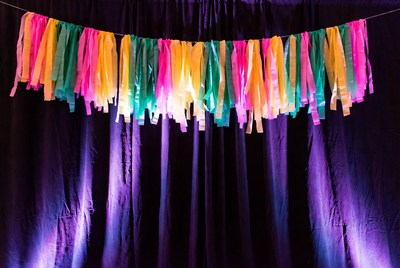 Colorful Tassel Garland on Purple Curtain