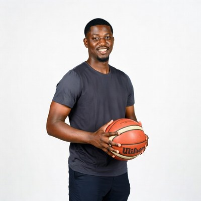African man holding basketball
