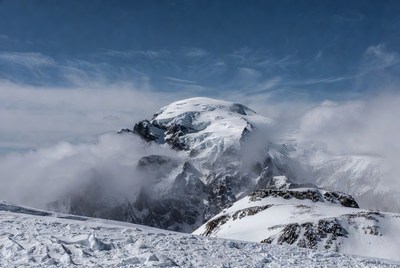 Snowy Mountain Peak in Clouds