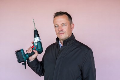 Man holding cordless drill