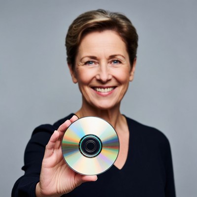 Smiling woman holding CD