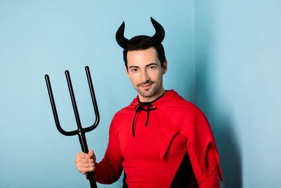 Man in devil costume with pitchfork