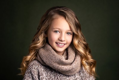 Smiling girl in scarf and sweater