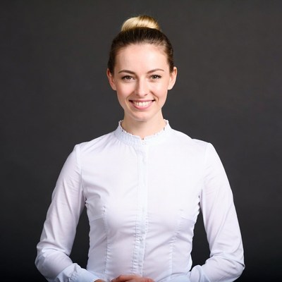 Smiling woman with bun hairstyle