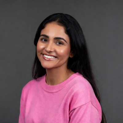 Smiling Asian woman in pink sweater