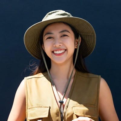 Asian girl smiling in safari hat