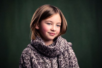 Girl in chunky scarf smiling