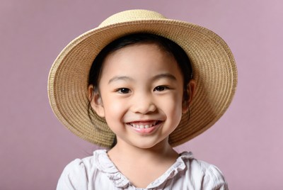 Asian girl smiling in straw hat