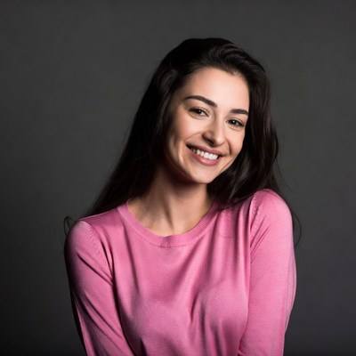 Smiling woman in pink sweater