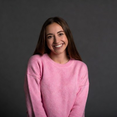 Smiling woman in pink sweater