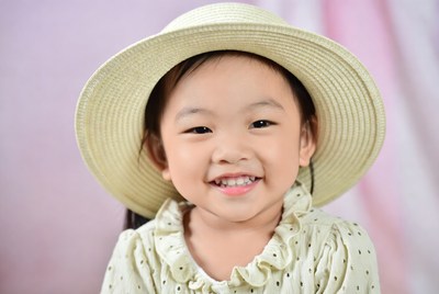 Asian girl smiling in straw hat