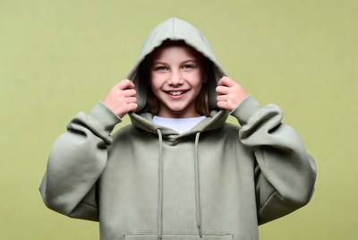 Girl smiling in green hoodie