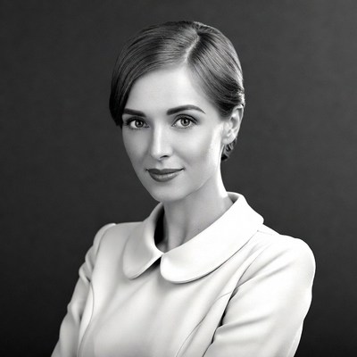 Woman with arms crossed in suit