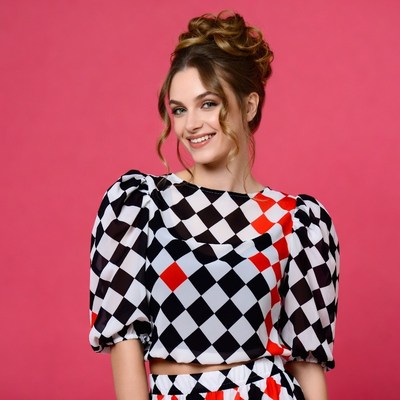 Woman in checkered blouse smiling