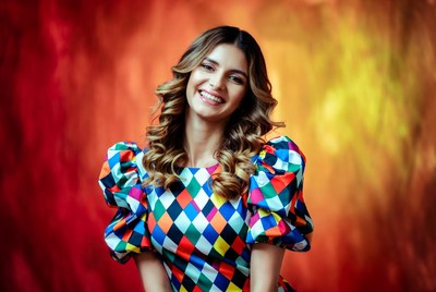 Smiling woman in colorful harlequin dress