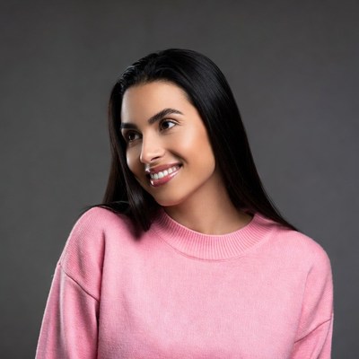 Smiling woman in pink sweater