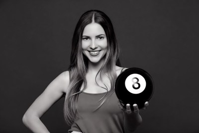 Woman holding 8-ball