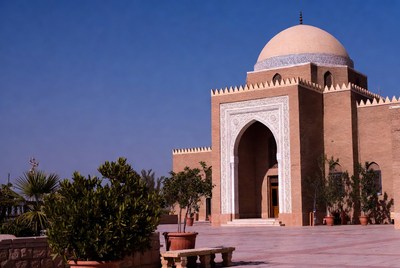 Traditional Mosque with Dome and Palm Trees
