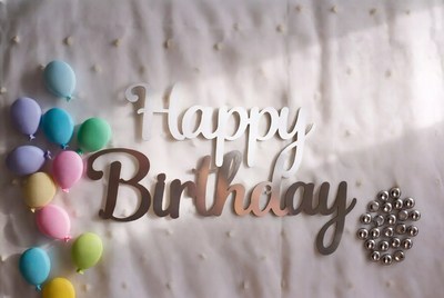 Happy Birthday balloons and sign