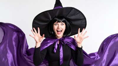 Excited woman in witch costume