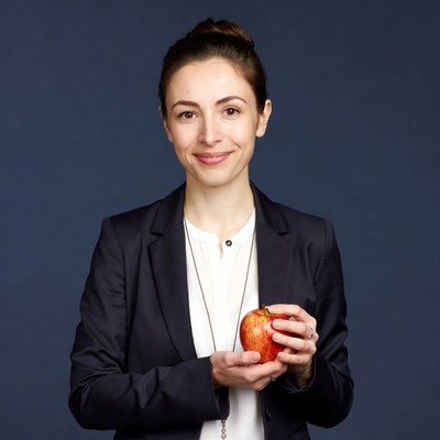 Woman holding red apple