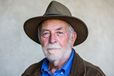 Elderly man wearing fedora hat