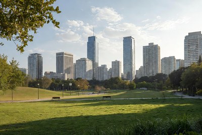 City skyline over green park