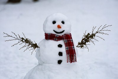 Snowman with red scarf and twigs