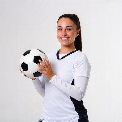 Smiling woman holding soccer ball