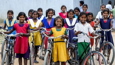 Indian girls with bicycles