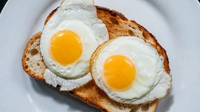 Two Fried Eggs on Toasted Bread
