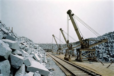 Cranes Working Stone Quarry Piles