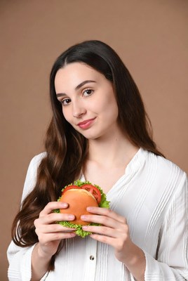 Woman holding burger
