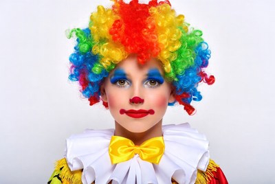 Girl in colorful clown costume