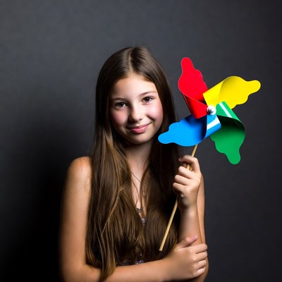 Girl holding colorful pinwheel