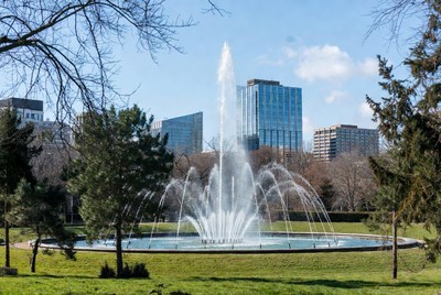 Fountain with skyscrapers and trees
