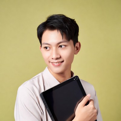 Asian man holding tablet