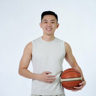 Asian man holding basketball