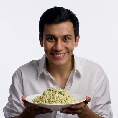 Man holding plate of pasta