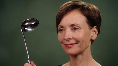 Woman holding silver spoon