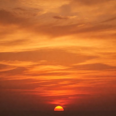 Sun setting on horizon