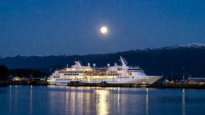 Cruise Ship Docked at Night with Moon