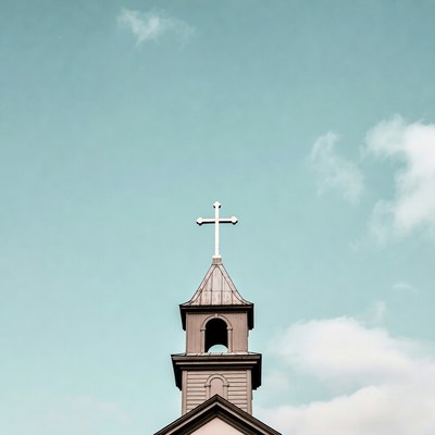 Church Steeple with Cross Against Sky